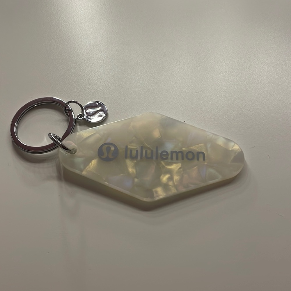 brand new lululemon diamond-shaped hotel keychain